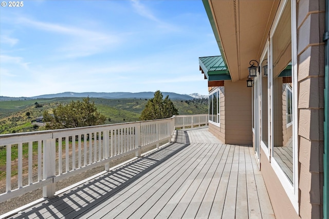 wooden terrace with a mountain view
