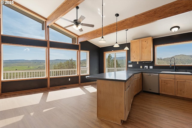 kitchen with dishwasher, a sink, a peninsula, wood finished floors, and vaulted ceiling with beams