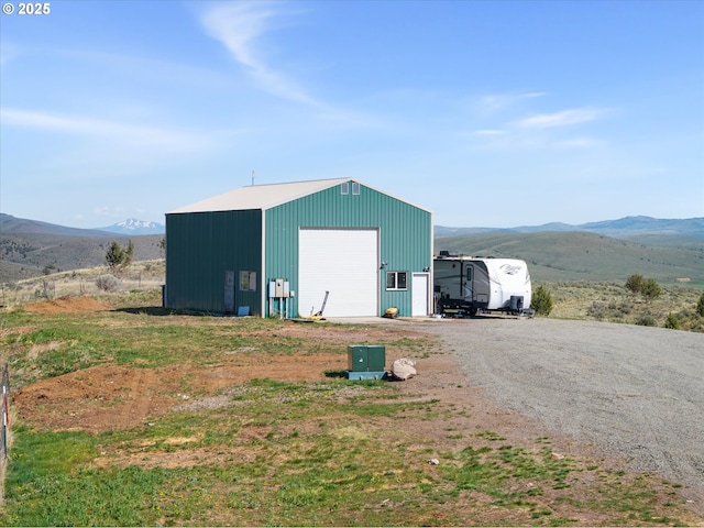view of outdoor structure featuring an outbuilding and a mountain view