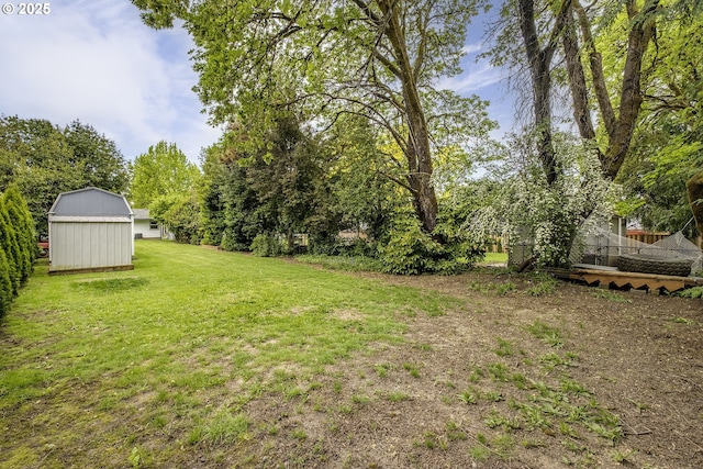 view of yard featuring an outbuilding and a storage shed