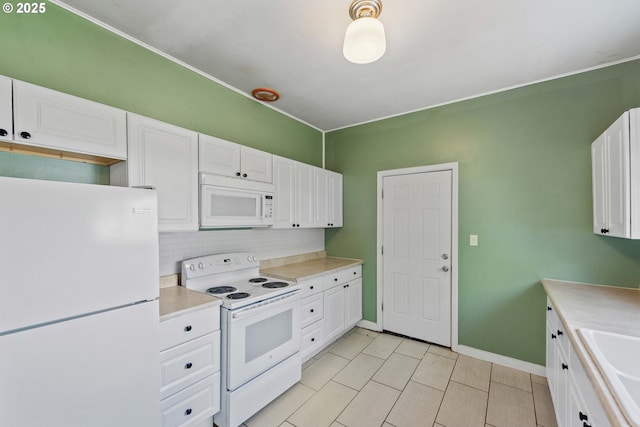 1296 W Central Blvd, Coquille, OR 97423 - kitchen featuring white appliances, tasteful backsplash, white cabinetry, light countertops, and light tile patterned floors