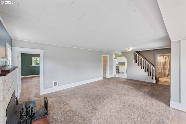 1296 W Central Blvd, Coquille, OR 97423 - unfurnished living room featuring stairs and carpet floors