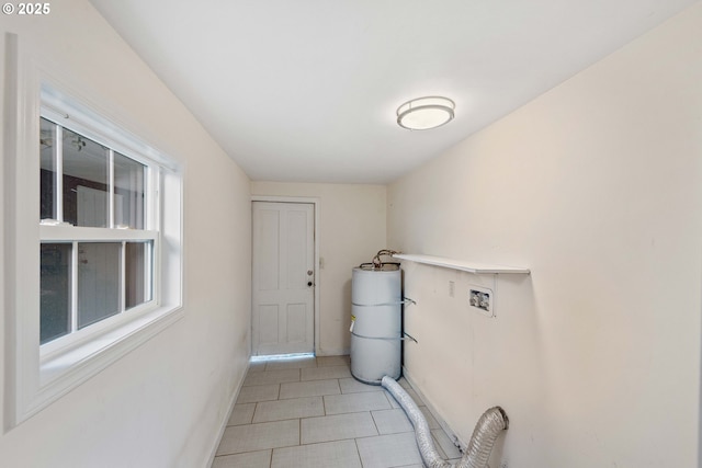 1296 W Central Blvd, Coquille, OR 97423 - washroom with washer hookup, water heater, and light tile patterned floors