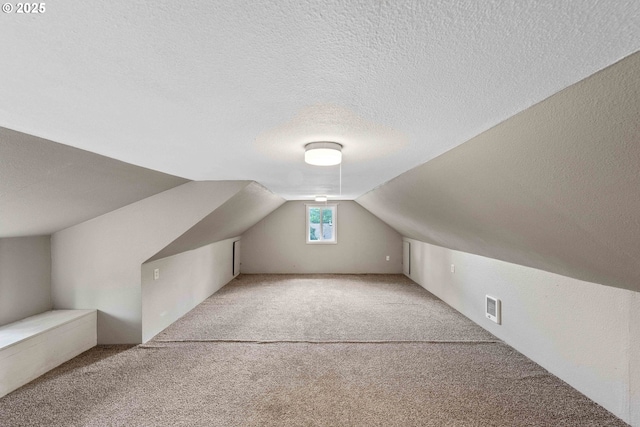 1296 W Central Blvd, Coquille, OR 97423 - bonus room featuring a textured ceiling, carpet, and vaulted ceiling