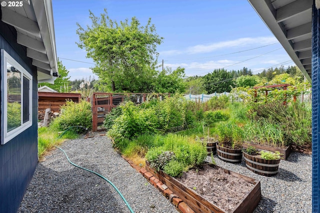 1296 W Central Blvd, Coquille, OR 97423 - fenced yard with a garden