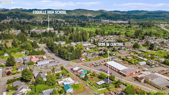 1296 W Central Blvd, Coquille, OR 97423 - aerial view of residential area with a mountain backdrop