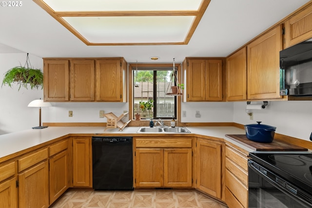 4131 Jessen Dr, Eugene, OR 97402 - kitchen with black appliances, light countertops, and brown cabinets