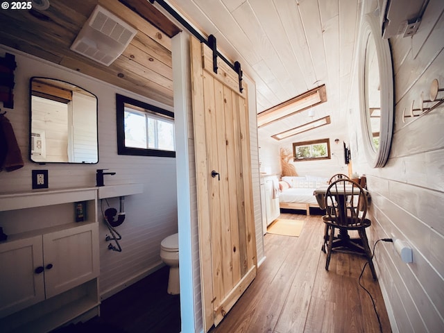 4131 Jessen Dr, Eugene, OR 97402 - bathroom featuring plenty of natural light, hardwood / wood-style floors, wood ceiling, and wood walls
