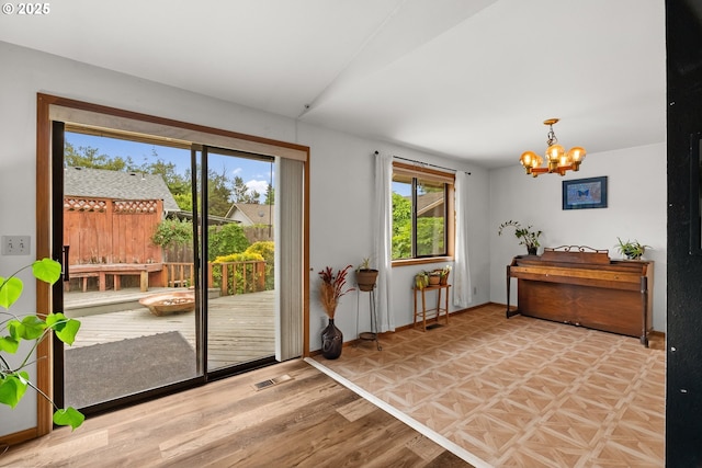 4131 Jessen Dr, Eugene, OR 97402 - doorway to outside featuring a chandelier and light wood-style floors