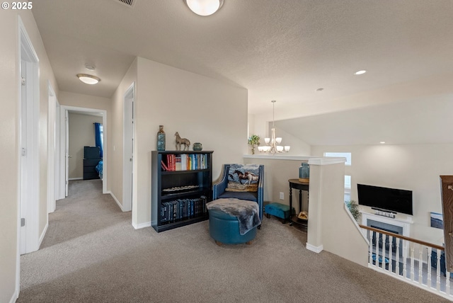 sitting room featuring baseboards, a textured ceiling, carpet flooring, a notable chandelier, and recessed lighting