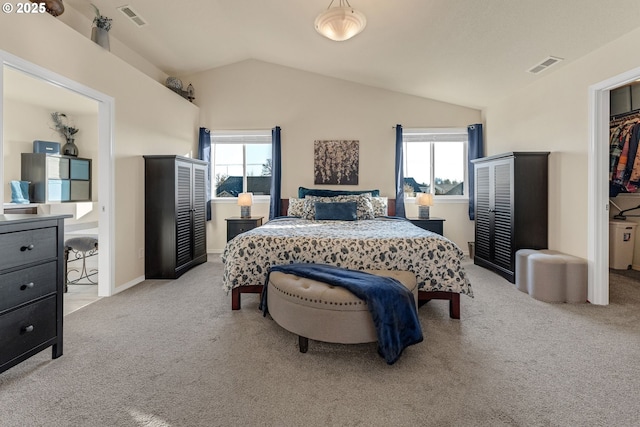 bedroom featuring lofted ceiling, multiple windows, light carpet, and visible vents