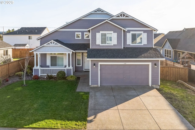 view of front facade with concrete driveway, an attached garage, covered porch, fence, and a front lawn