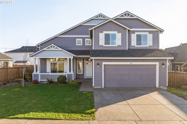 craftsman-style home with concrete driveway, a porch, a front yard, and fence