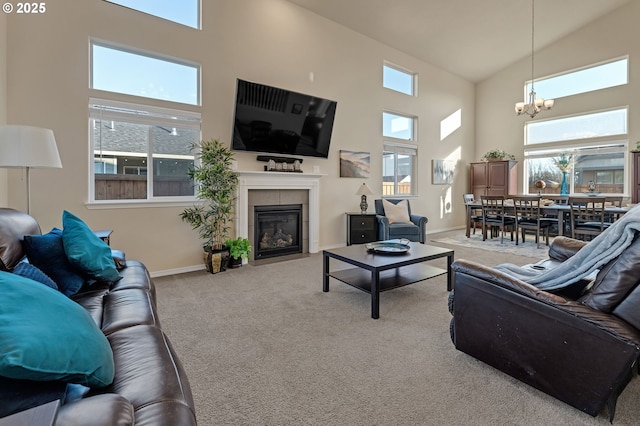 carpeted living room with a tile fireplace, plenty of natural light, and baseboards