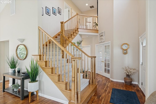 5277 Landon St, Salem, OR 97306 - staircase featuring a high ceiling, hardwood / wood-style floors, and baseboards