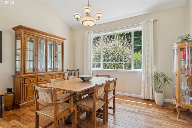 5277 Landon St, Salem, OR 97306 - dining space featuring light wood-type flooring, healthy amount of natural light, vaulted ceiling, and a chandelier