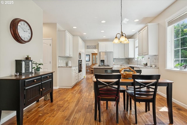 5277 Landon St, Salem, OR 97306 - dining room with light wood-type flooring, recessed lighting, and baseboards