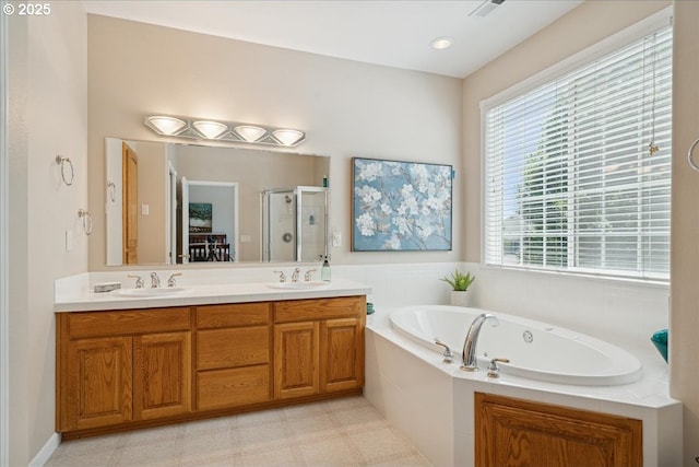 5277 Landon St, Salem, OR 97306 - full bathroom with a shower stall, a whirlpool tub, double vanity, and tile patterned floors