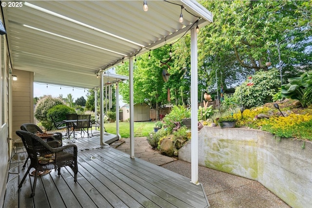 5277 Landon St, Salem, OR 97306 - wooden deck with outdoor dining space and a patio