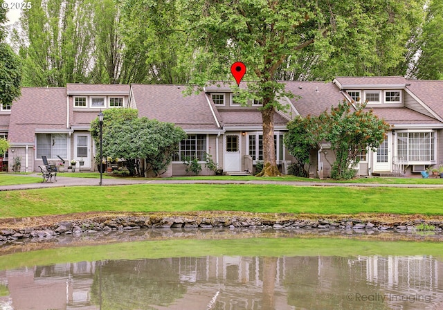 13775 SW Scholls Ferry Rd Unit 16, Beaverton, OR 97008 - view of front facade featuring roof with shingles, a front yard, and a water view