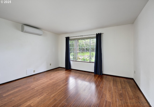 13775 SW Scholls Ferry Rd Unit 16, Beaverton, OR 97008 - unfurnished room featuring an AC wall unit and wood finished floors