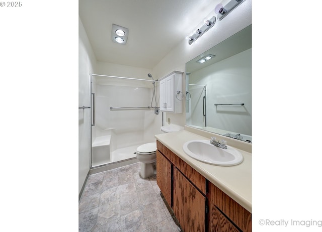 13775 SW Scholls Ferry Rd Unit 16, Beaverton, OR 97008 - bathroom featuring a shower stall, vanity, and stone finish floors