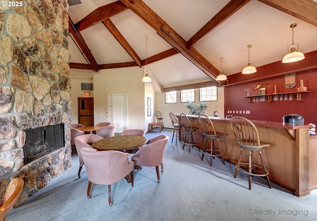 13775 SW Scholls Ferry Rd Unit 16, Beaverton, OR 97008 - carpeted dining room with wet bar, high vaulted ceiling, beam ceiling, and a stone fireplace