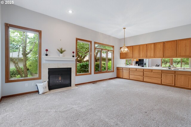 32680 SW Lake Point Ct, Wilsonville, OR 97070 - unfurnished living room featuring baseboards, light carpet, a premium fireplace, and recessed lighting
