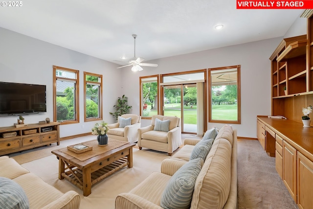 32680 SW Lake Point Ct, Wilsonville, OR 97070 - living area featuring baseboards, light colored carpet, a ceiling fan, and recessed lighting