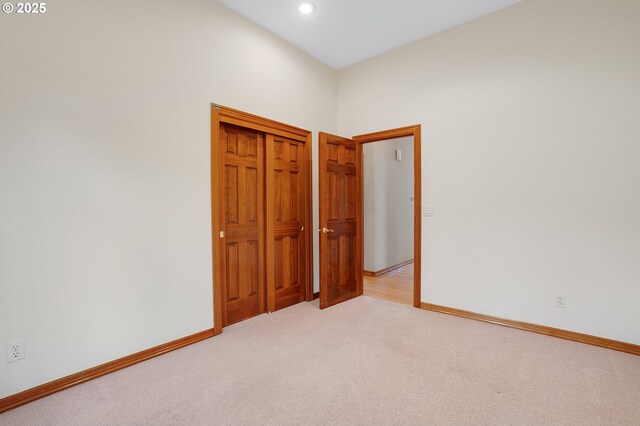 32680 SW Lake Point Ct, Wilsonville, OR 97070 - unfurnished bedroom featuring light colored carpet, baseboards, recessed lighting, and a closet