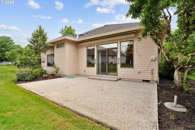 32680 SW Lake Point Ct, Wilsonville, OR 97070 - rear view of house with a patio and a lawn