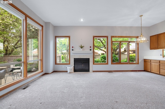 32680 SW Lake Point Ct, Wilsonville, OR 97070 - unfurnished living room with light carpet, a fireplace with flush hearth, baseboards, and recessed lighting