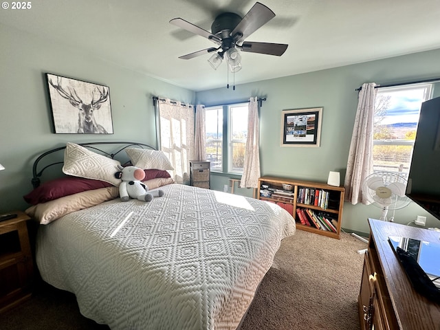 bedroom featuring ceiling fan and carpet flooring