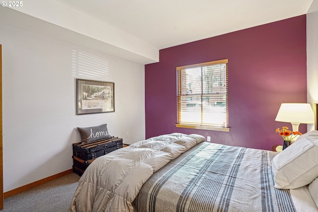 carpeted bedroom with baseboards