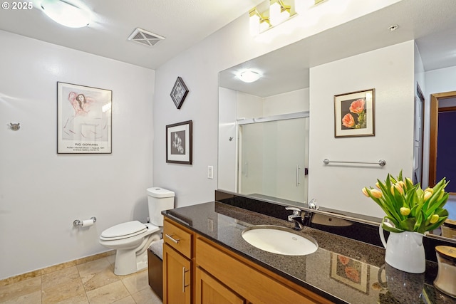 full bath featuring a stall shower, baseboards, visible vents, toilet, and vanity