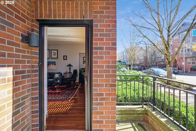 property entrance with brick siding