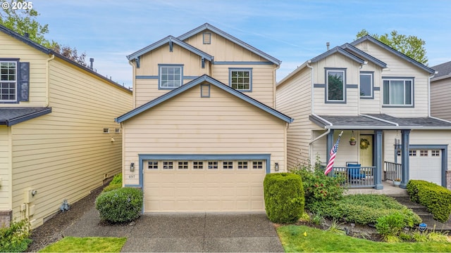 697 NW Rubus Ln, Hillsboro, OR 97124 - traditional-style house featuring an attached garage, covered porch, driveway, and board and batten siding