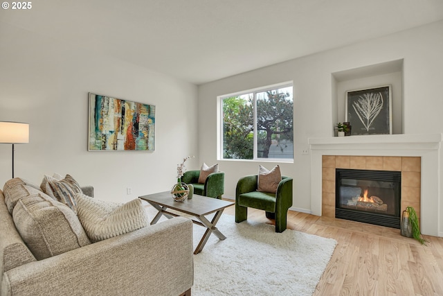 697 NW Rubus Ln, Hillsboro, OR 97124 - living area with wood finished floors and a tile fireplace