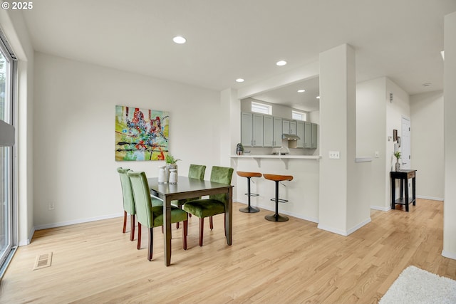 697 NW Rubus Ln, Hillsboro, OR 97124 - dining area with light wood-style floors, baseboards, and recessed lighting