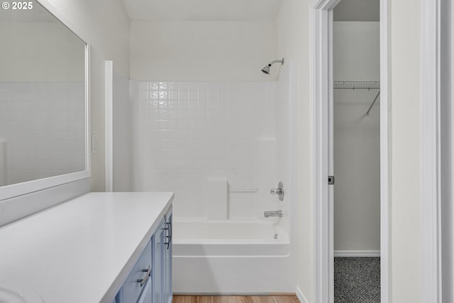 697 NW Rubus Ln, Hillsboro, OR 97124 - full bathroom featuring vanity,  shower combination, and a walk in closet