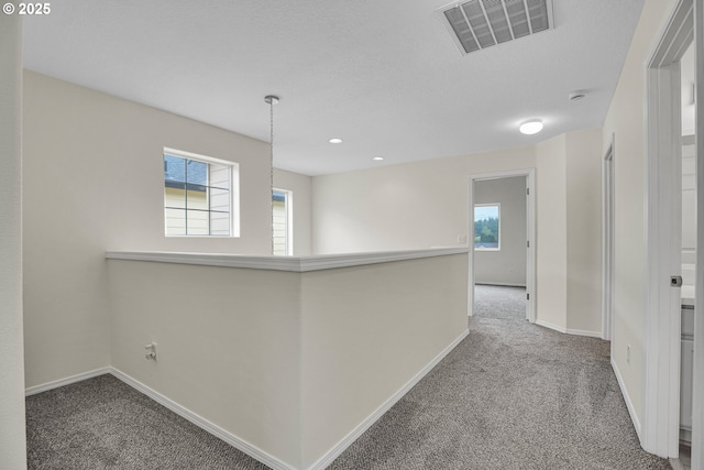 697 NW Rubus Ln, Hillsboro, OR 97124 - hallway featuring carpet floors, baseboards, and recessed lighting