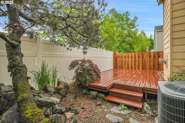 697 NW Rubus Ln, Hillsboro, OR 97124 - wooden terrace with a fenced backyard and central AC unit