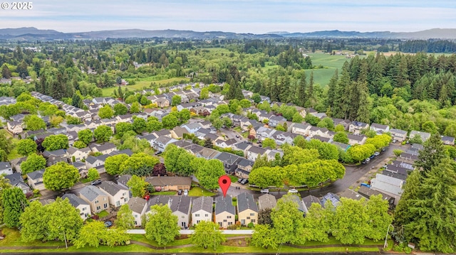 697 NW Rubus Ln, Hillsboro, OR 97124 - aerial perspective of suburban area with a mountainous background