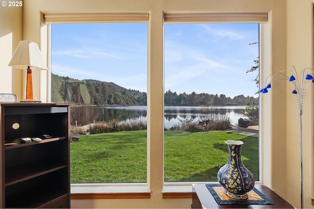 doorway to outside with a water view