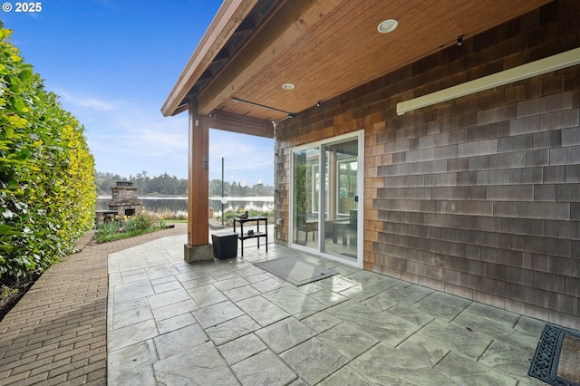 view of patio / terrace with a water view