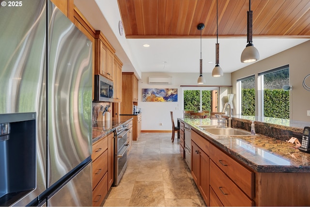 kitchen with an AC wall unit, pendant lighting, a sink, appliances with stainless steel finishes, and wood ceiling