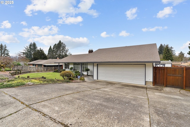 single story home with a front lawn, fence, a chimney, a garage, and driveway