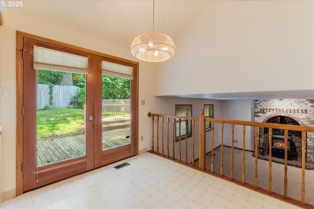 20916 SW Siletz Ct, Tualatin, OR 97062 - entryway with a fireplace and a chandelier