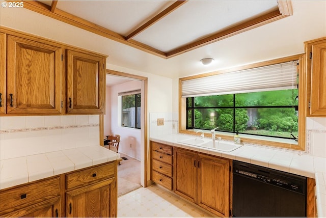 20916 SW Siletz Ct, Tualatin, OR 97062 - kitchen featuring dishwasher, tasteful backsplash, brown cabinets, tile counters, and light floors