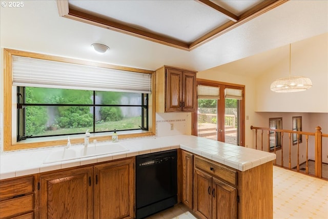 20916 SW Siletz Ct, Tualatin, OR 97062 - kitchen with black dishwasher, a peninsula, and brown cabinetry